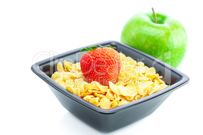 strawberry,apple and flakes in a bowl isolated on white