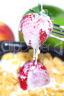 strawberry,milk and flakes in a bowl isolated on white