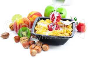 strawberry, peach, nuts,apple, kiwi, milk and flakes in a bowl i
