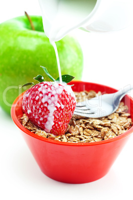 apple, fork, milk and wheat in a bowl isolated on white