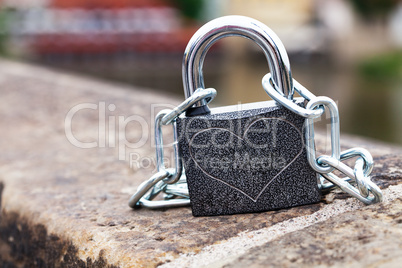 padlock and chain on the parapet