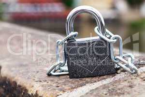 padlock and chain on the parapet