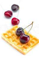 waffles and cherries isolated on white