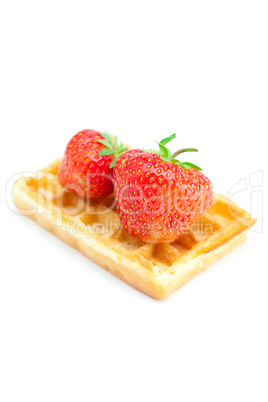 Waffles and strawberries isolated on white