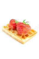 Waffles and strawberries isolated on white