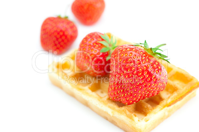 Waffles and strawberries isolated on white