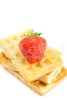 Waffles and strawberries isolated on white