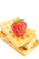 Waffles and strawberries isolated on white