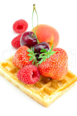 waffles,apricot, cherries, strawberries and raspberries isolated