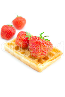 Waffles and strawberries isolated on white