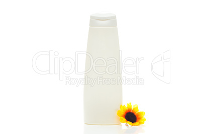 cosmetic containers and flower isolated on white