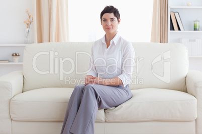 Woman sitting on a sofa