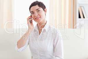 Brunette businesswoman with a mobile