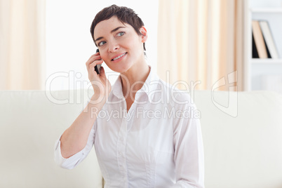 Smiling woman with a cellphone