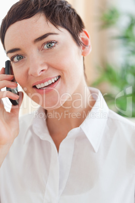 Close up of a charming woman with a cellphone