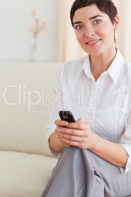 Portrait of a cute woman with a cellphone