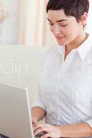 Close up of a cute woman with a laptop