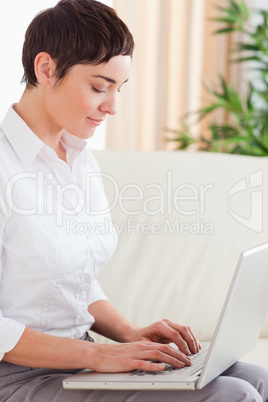 Brunette woman with a laptop