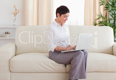 Beautiful woman with a laptop looking