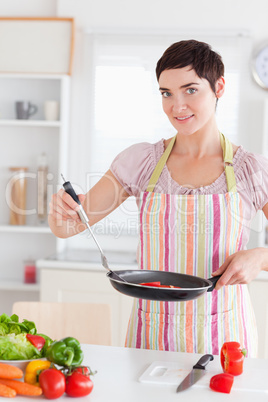 Gorgeous woman with a pan