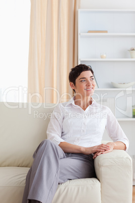 Cute woman sitting on a sofa