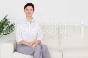 Beautiful woman sitting on a sofa