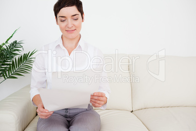 Charming woman with a paper