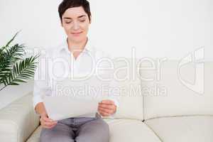 Charming woman with a paper