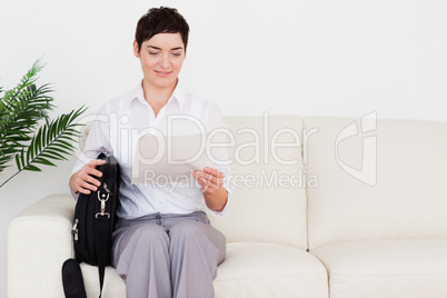Businesswoman with a paper and a bag