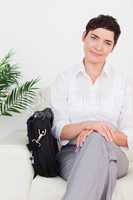 Smirking Businesswoman with a bag