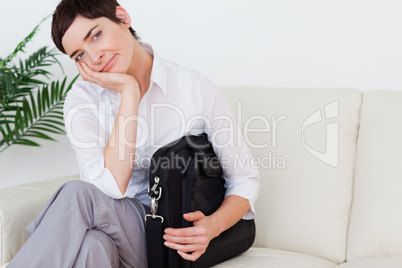 Bored businesswoman sitting on a sofa