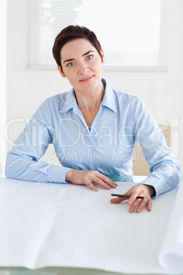 Working businesswoman with a architectural plan