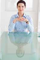 Businesswoman sitting behind a desk