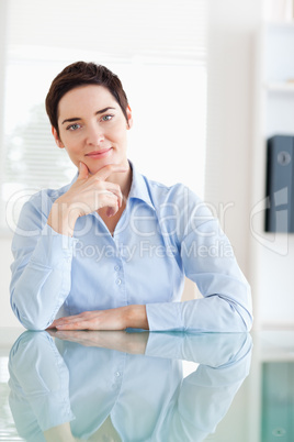 Portrait of a Businesswoman sitting behind a desk