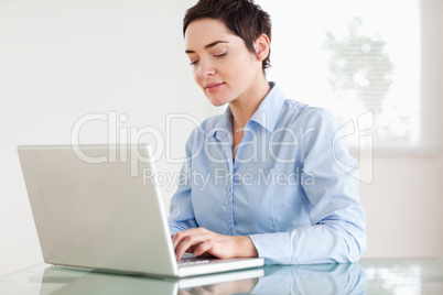 Charming short-haired businesswoman with a laptop