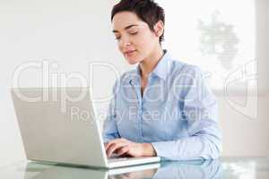 Charming short-haired businesswoman with a laptop