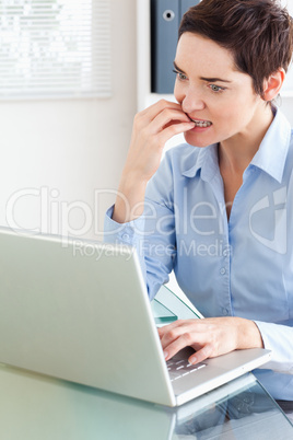 Angry businesswoman with a laptop