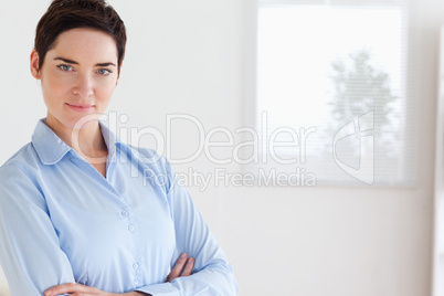 Serious brunette businesswoman posing