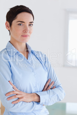 Brunette short-haired businesswoman posing