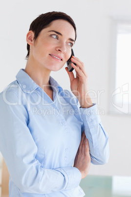 Brunette short-haired businesswoman on the phone