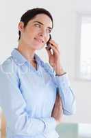 Brunette short-haired businesswoman on the phone