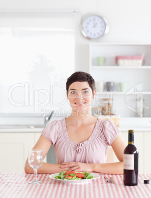 Cute Woman sitting at a table with wine for lunch