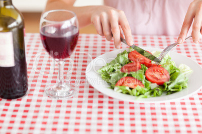 Charming Woman eating lunch and drinking wine
