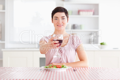 Woman toasting with wine