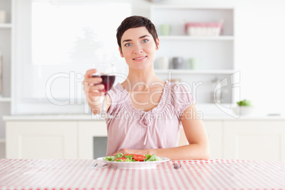 Cute Woman toasting with wine