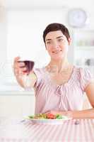 Charming Woman toasting with wine