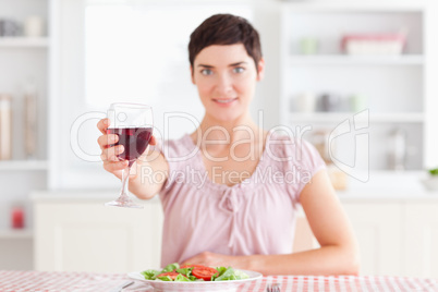 Smiling Woman toasting with wine