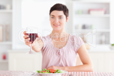 Smiling brunette Woman toasting with wine