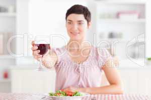 Smiling brunette Woman toasting with wine
