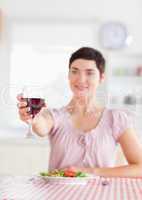Charming brunette Woman toasting with wine